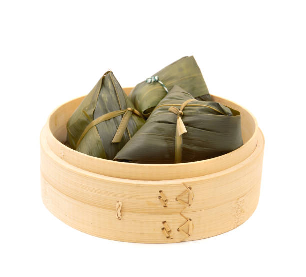 istock traditional wrapped rice dumplings  isolated on white background. 1153969399