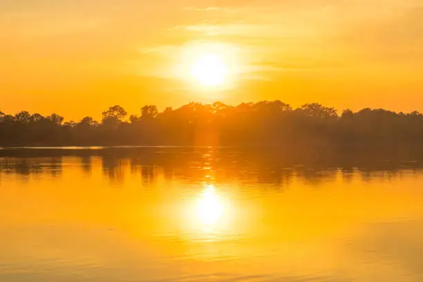 Photo of Beautiful sunset reflection on the water of Srah Srang (The Royal Bath) a large lake was dug in the mid-10th century.