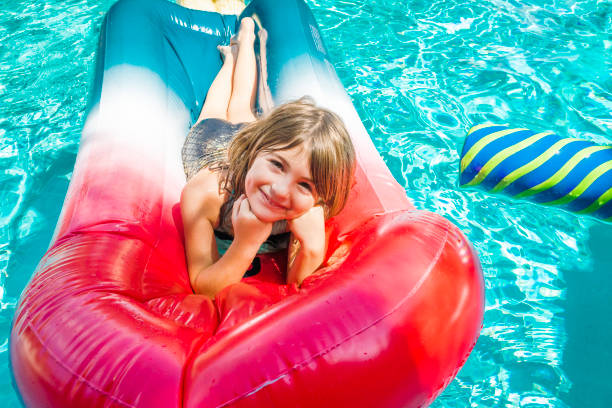 istock Summer at the pool on a fun float, childhood at its best 1153970691