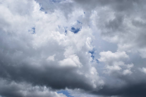 istock Cumulonimbus cloud formations on tropical blue sky 1153971489