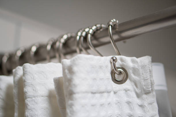 istock Decorative luxurious shower curtain on hooks. 1153977588