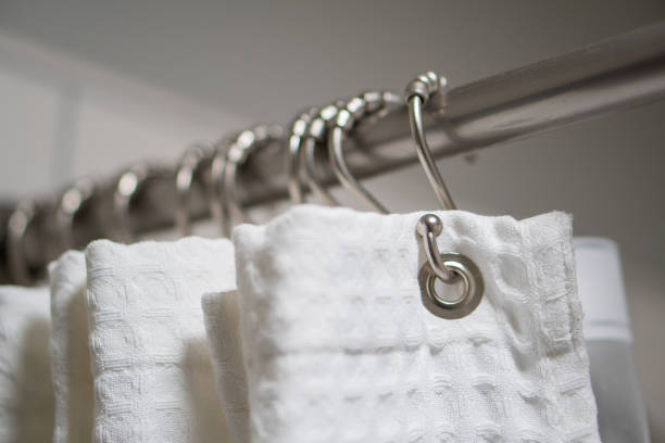 Decorative luxurious shower curtain on hooks. stock photo