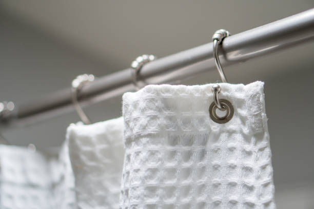 istock Decorative luxurious shower curtain on hooks. 1153977592