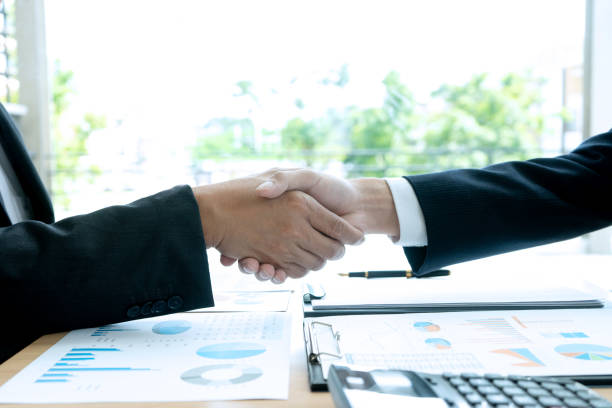 istock businessman hand shake with another business man 1153979144