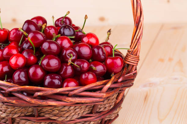 istock Fresh cherries in a wicker basket. 1153980445