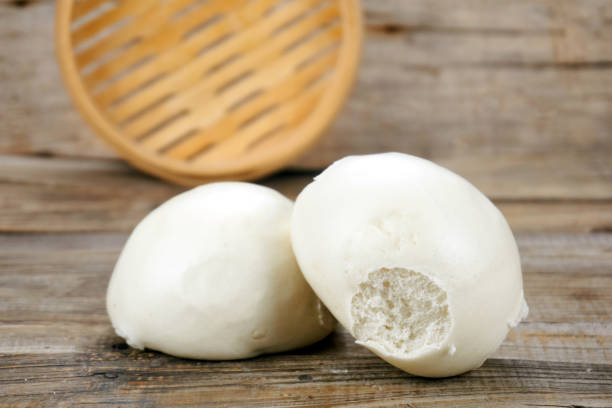 istock Steamed buns   Close up on wood background 1153982997
