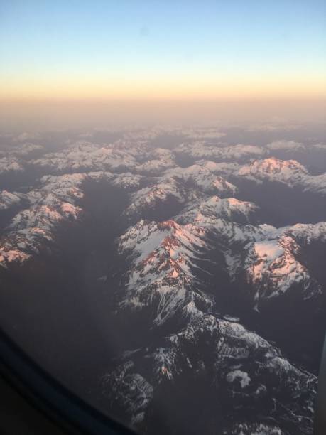 istock Golden snow capped mountains 1153986163