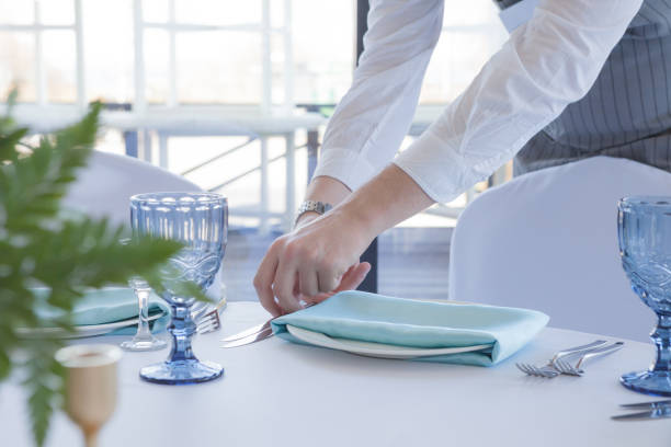 istock Restaurant waiter serves a table for a wedding celebration 1153987090
