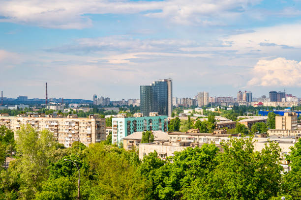 istock Kiev cityscape against the blue sky with white clouds. 1153987142
