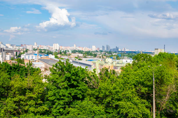 istock Kiev cityscape against the blue sky with white clouds. 1153987168