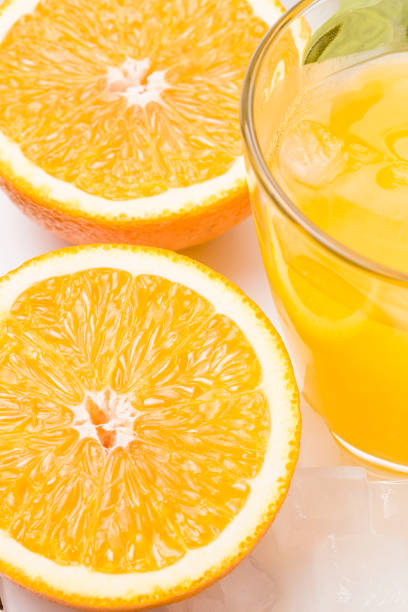 istock Fresh and delicious oranges and orange juice 1153989094