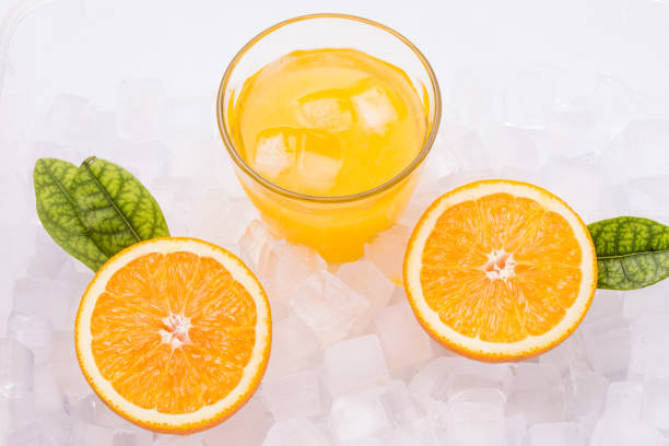 istock Fresh and delicious oranges and orange juice 1153989098