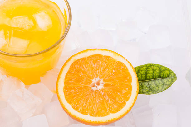 istock Fresh and delicious oranges and orange juice 1153989109