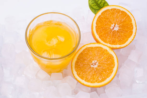 istock Fresh and delicious oranges and orange juice 1153989168
