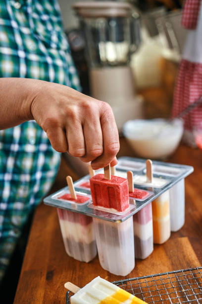 istock Preparing Mango, Strawberry, Chocolate, Yogurt Ice Cream on Stick 1153990959