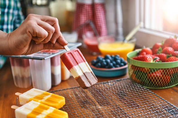 istock Preparing Mango, Strawberry, Chocolate, Yogurt Ice Cream on Stick 1153990968