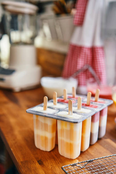 istock Preparing Mango, Strawberry, Chocolate, Yogurt Ice Cream on Stick 1153990999