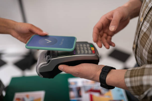 istock Close-up of a customer doing a successful payment via PayPass 1153992271