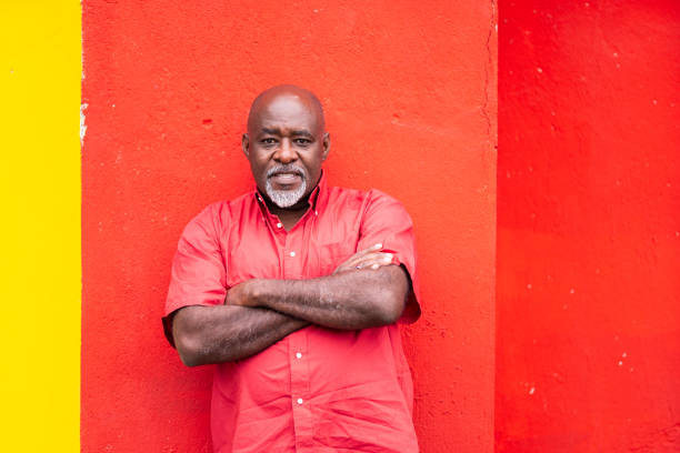 istock Mature afro man portrait on colorful background 1153996685