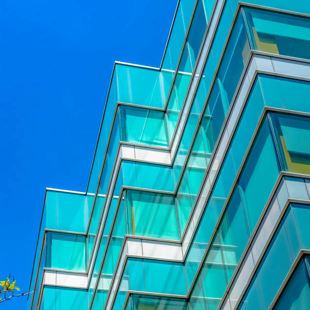 istock Frame Square Modern building exterior viewed from below with blue sky in the background 1153997749