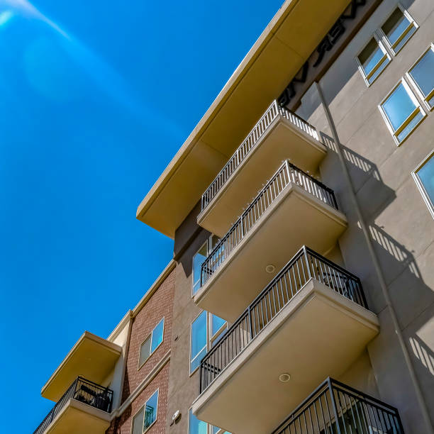 istock Frame Square View from below of a building with small balconies on a sunny day 1153997767