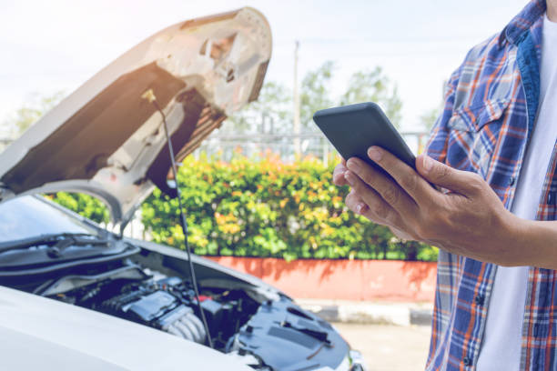 istock Asia man stand front a broken car calling for assistance 1153997904