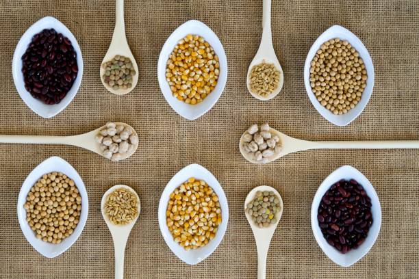 istock Collection of different grains in spoons and bowls. 1153999034