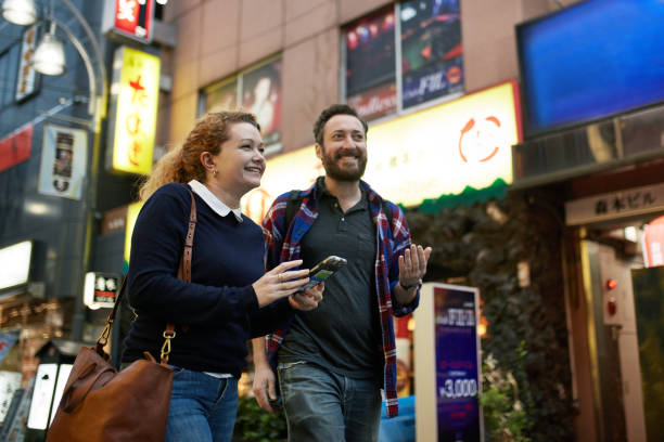 istock Smiling Caucasian Couple Exploring Tokyo at Dusk 1154000181