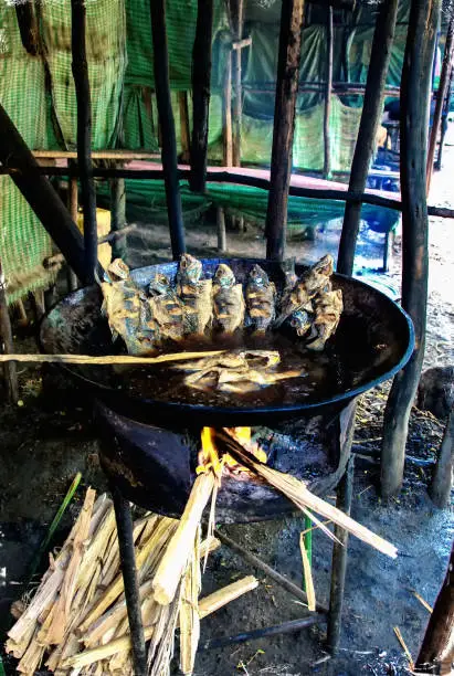 The fish market at Awassa lake, Ethiopia. Preparation of the fish in cauldron.