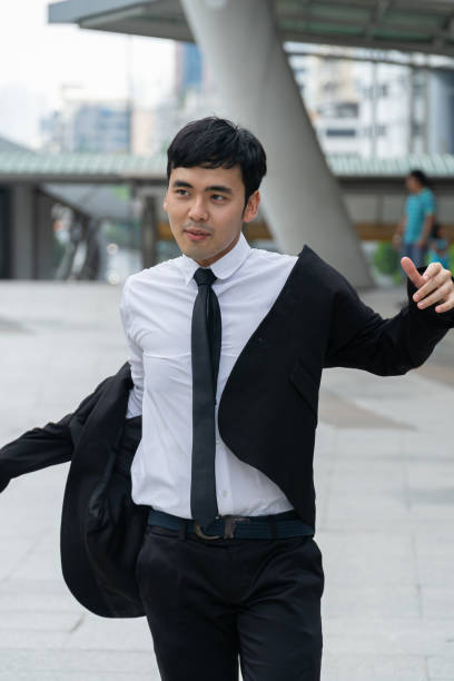 istock Asian business man wearing black suit. 1154002069