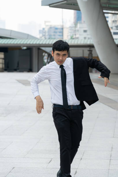 istock Asian business man wearing black suit. 1154002100