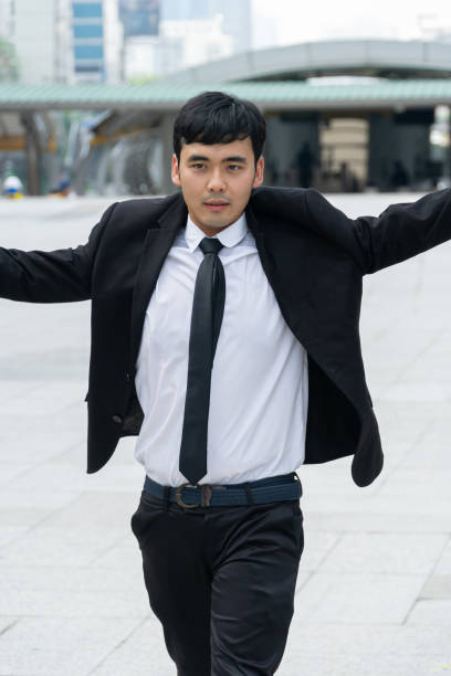istock Asian business man wearing black suit. 1154002117