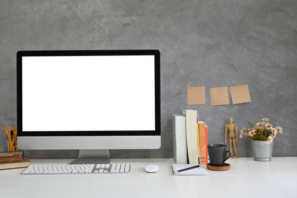 istock Workspace mockup computer, books, coffee and office supplies with loft wall. 1154003012