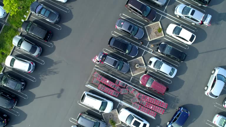 Parking lot at shopping plaza. Drone point of view.