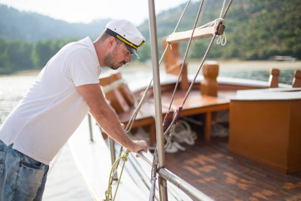 istock Young captain with his boat 1154009953