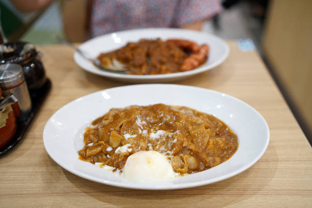 istock Japanese curry rice with thinly sliced boiled pork and soft boiled egg. 1154013117