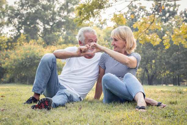 istock Romantic mature couple in the park in fall. 1154017916