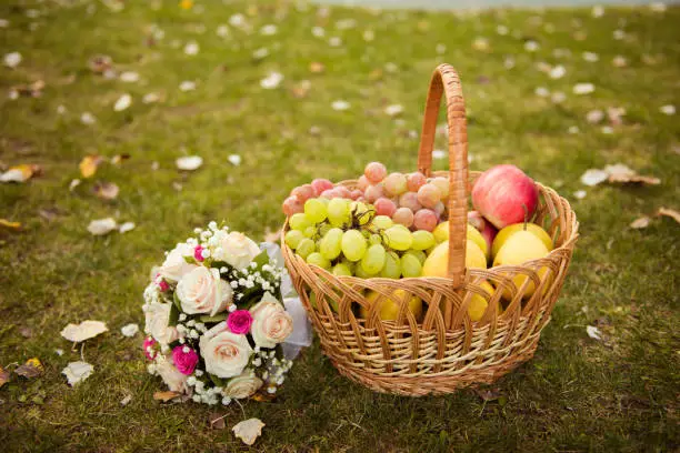 Photo of Wedding bouquet and bascet of fruits