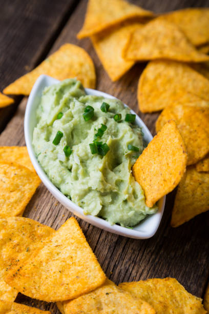 istock Guacamole Sauce and Nachos Chips 1154023582