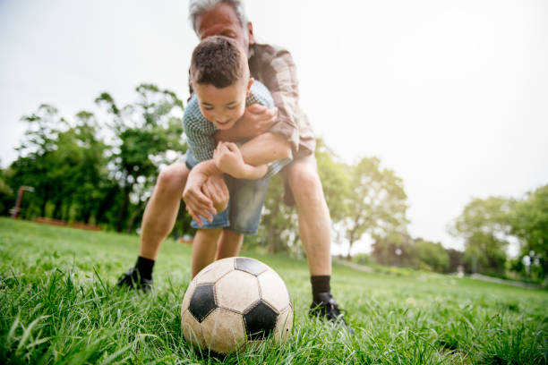 istock Playing Football With Grandad 1154023727