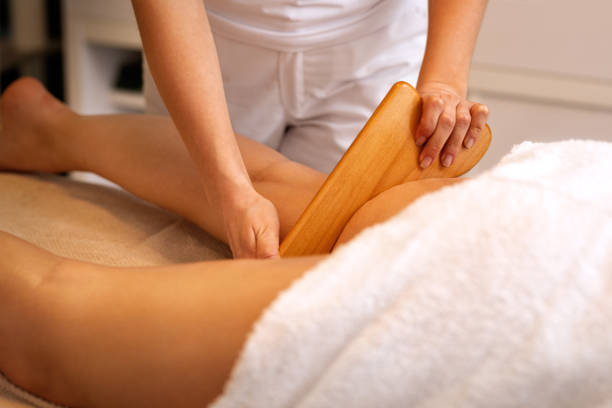 istock anticellulite treatment‎ with wooden instrument 1154023738