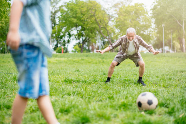 istock Playing Football With Grandad 1154023824