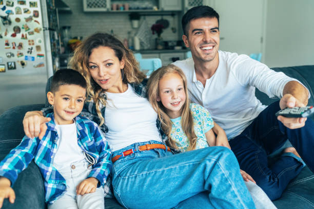 istock Family watching television 1154024296
