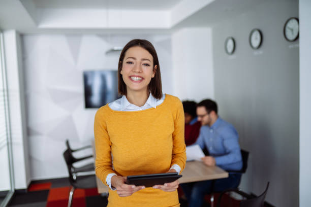 istock Young businesswoman using digital tablet in the office 1154026855