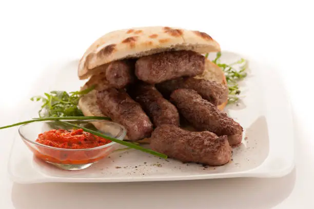 photo of Cevapi, cevapcici, traditional Balkan food - delicious minced meat
 .