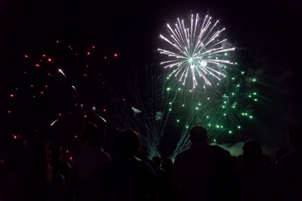 istock Crowd watching fireworks and celebrating new year 1154028251