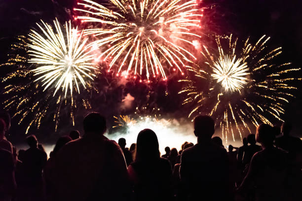 Crowd watching fireworks and celebrating new year eve