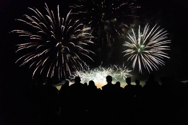 istock Crowd watching fireworks and celebrating new year eve 1154028387