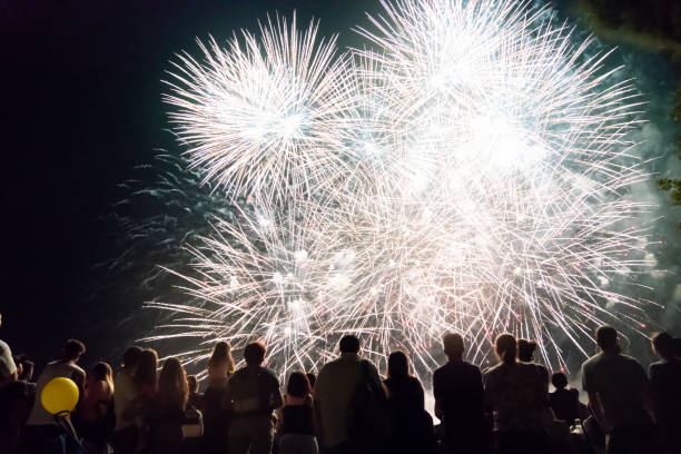 istock Crowd watching fireworks and celebrating new year eve 1154028408
