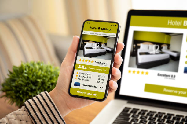 istock female hand holding phone with app hotel booking on screen 1154028463